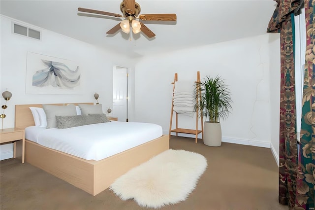 bedroom with carpet floors, baseboards, visible vents, and a ceiling fan