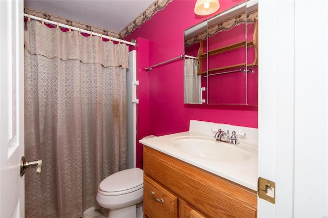 bathroom with toilet, a shower with shower curtain, and vanity