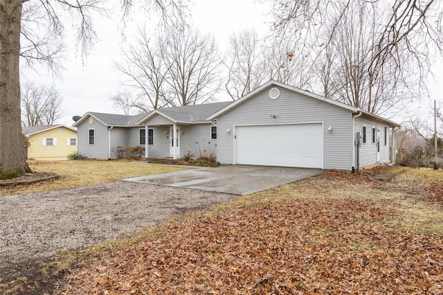 ranch-style home featuring driveway and an attached garage