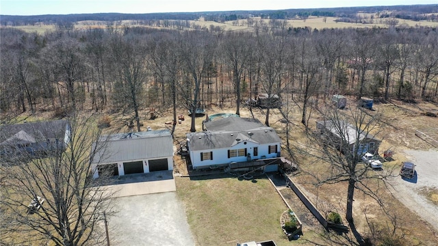 aerial view featuring a wooded view