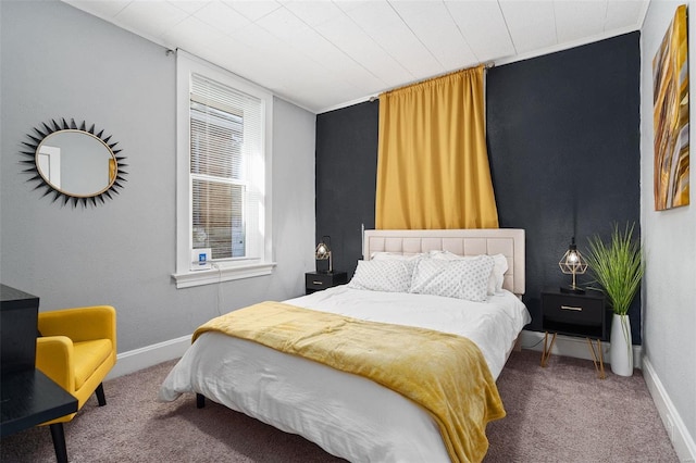 bedroom with carpet floors and baseboards