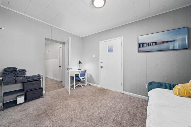 bedroom featuring carpet and crown molding