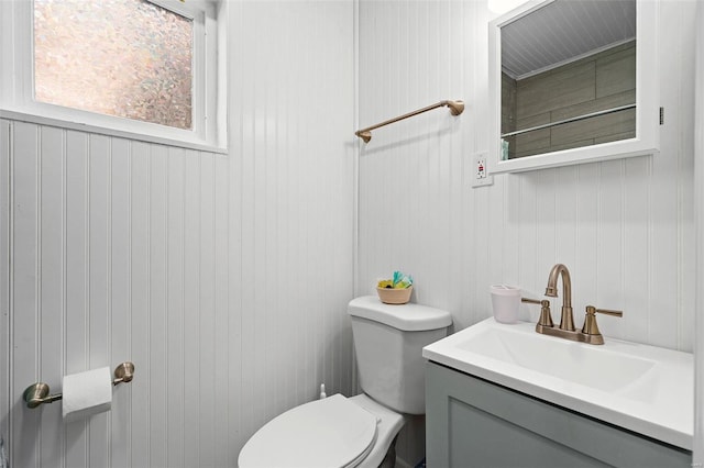 bathroom featuring toilet and vanity