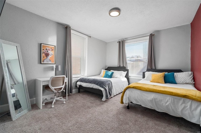 carpeted bedroom with baseboards, a textured ceiling, and a textured wall