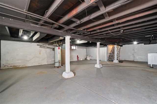 unfinished basement featuring washer / clothes dryer and gas water heater