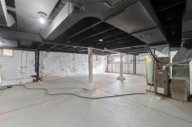 basement with gas water heater and heating unit