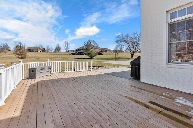 wooden deck with a lawn