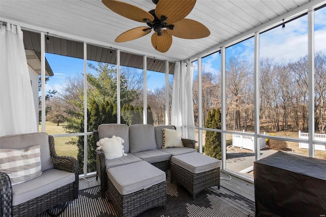 sunroom with ceiling fan and a wealth of natural light