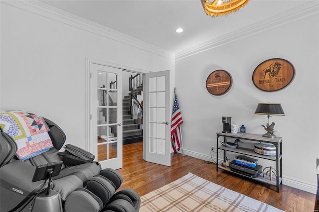 living area with baseboards, stairway, ornamental molding, wood finished floors, and french doors