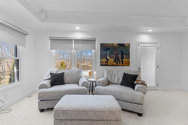 carpeted living area featuring crown molding, recessed lighting, baseboards, and a healthy amount of sunlight