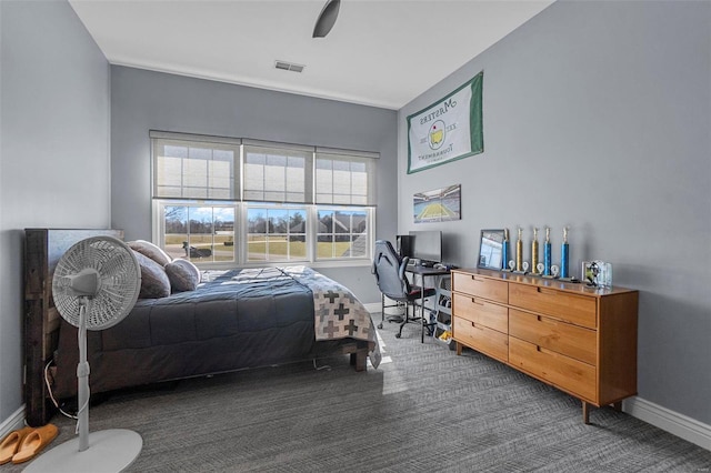 bedroom featuring baseboards, visible vents, ceiling fan, and carpet flooring