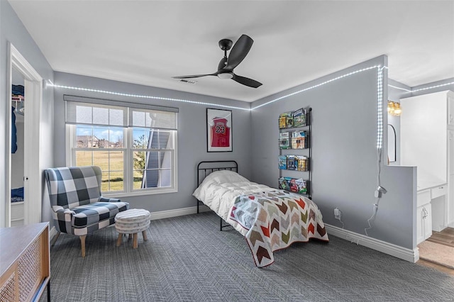 carpeted bedroom with a ceiling fan, visible vents, and baseboards