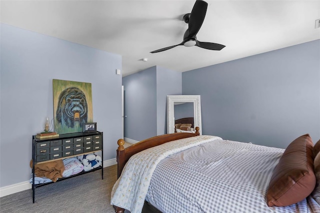 carpeted bedroom with ceiling fan and baseboards