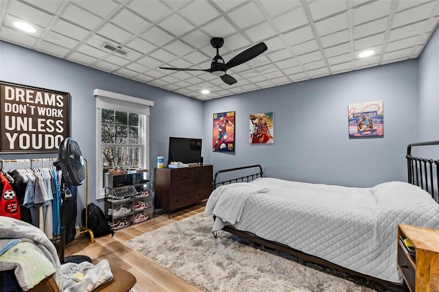 bedroom with recessed lighting, visible vents, ceiling fan, and wood finished floors