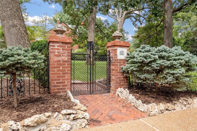 view of gate with fence