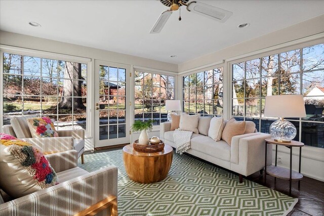 sunroom / solarium with ceiling fan and a healthy amount of sunlight