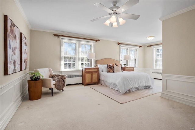 bedroom featuring light carpet, multiple windows, and radiator