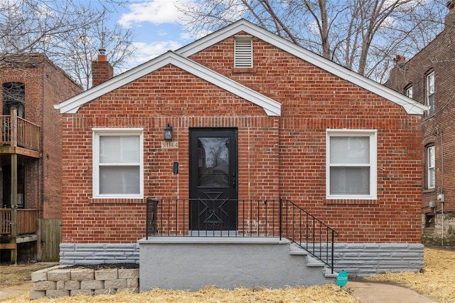 view of front facade featuring brick siding