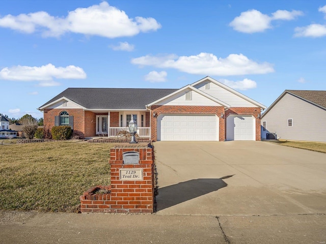 ranch-style home with brick siding, a porch, a garage, driveway, and a front lawn