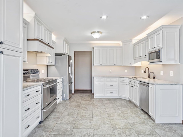 kitchen with stainless steel appliances, white cabinetry, a sink, and under cabinet range hood