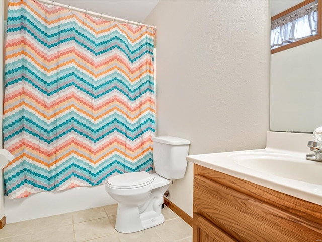 bathroom with toilet, vanity, baseboards, tile patterned floors, and shower / bathtub combination with curtain