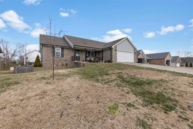 single story home with a garage, covered porch, brick siding, and driveway