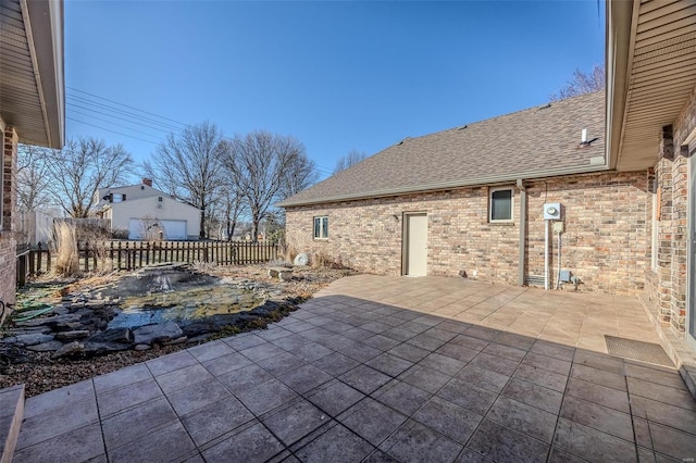 view of patio / terrace featuring fence