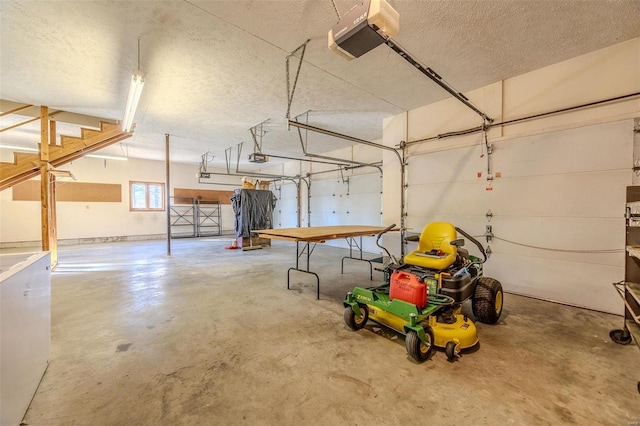 garage featuring a garage door opener and fridge