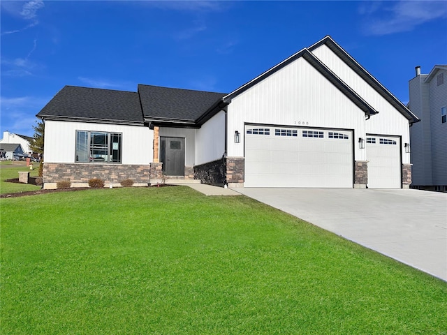 view of front of property with stone siding, concrete driveway, an attached garage, and a front lawn