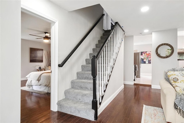 stairway with ceiling fan, recessed lighting, hardwood / wood-style flooring, and baseboards