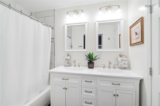 bathroom featuring double vanity, shower / bath combo, and a sink