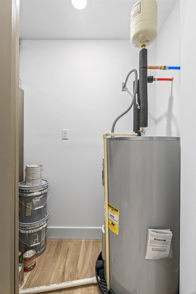 utility room with electric water heater