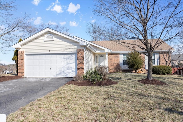 ranch-style house with an attached garage, driveway, a front lawn, and brick siding