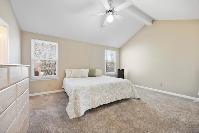 carpeted bedroom featuring lofted ceiling with beams, ceiling fan, and baseboards