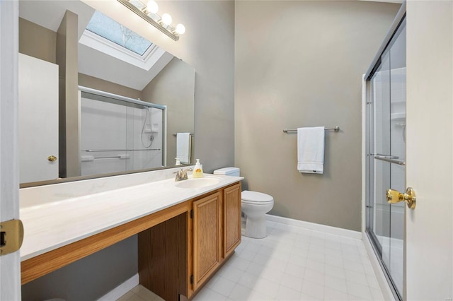 full bathroom featuring vaulted ceiling with skylight, a shower with door, vanity, and toilet