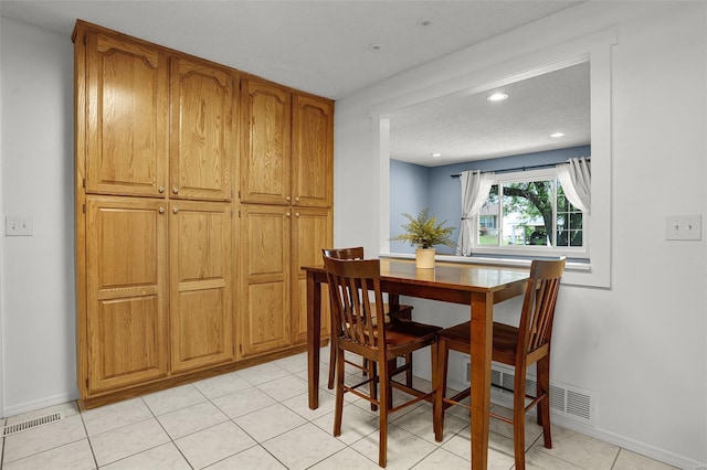 dining area with recessed lighting, baseboards, and visible vents