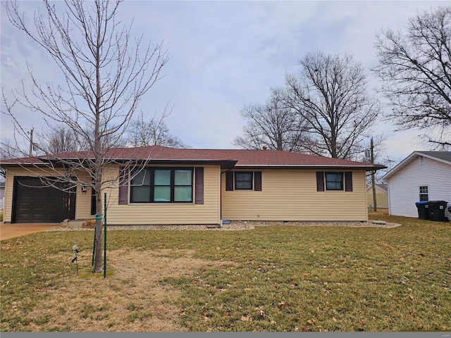 ranch-style house with an attached garage, concrete driveway, and a front yard