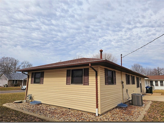 view of side of property featuring cooling unit