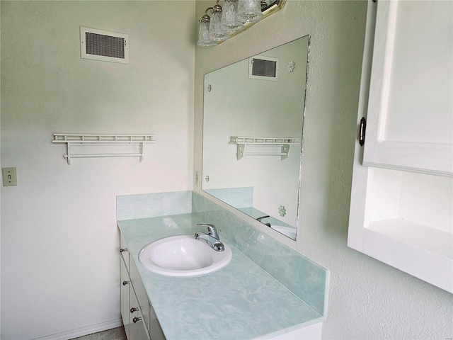 bathroom featuring visible vents and vanity