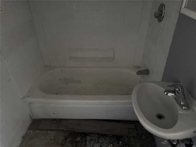 full bath with a sink and a bath