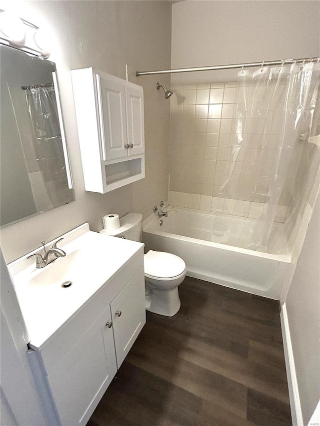 full bath featuring vanity, shower / tub combo, wood finished floors, and toilet