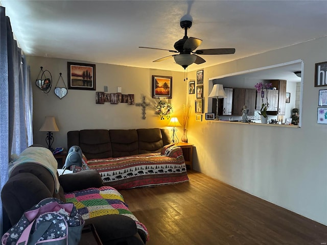 living area featuring ceiling fan and wood finished floors