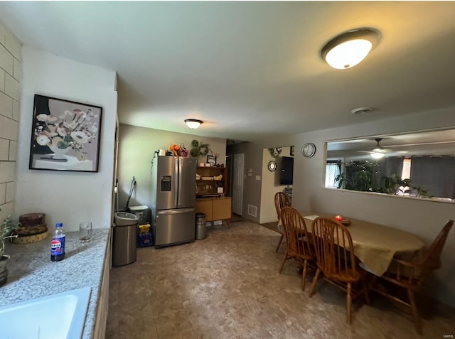 dining space featuring visible vents and a ceiling fan