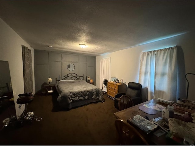 carpeted bedroom with a textured ceiling