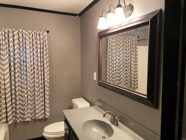 bathroom featuring ornamental molding, shower / bath combo, vanity, and toilet