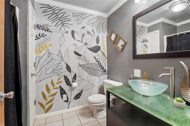 bathroom with a textured wall, toilet, ornamental molding, vanity, and tile patterned floors