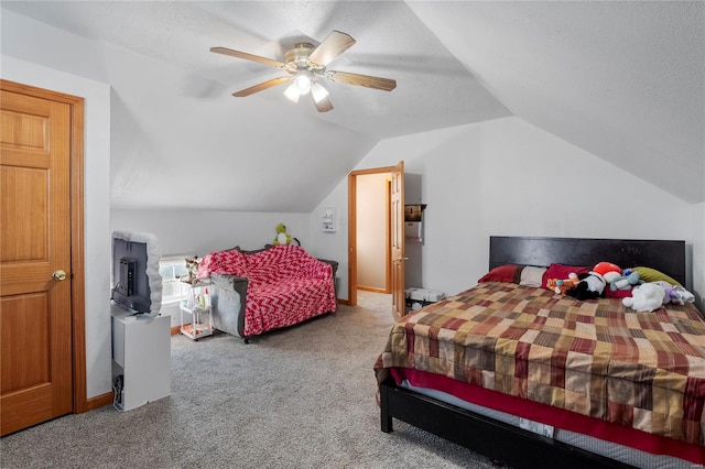 bedroom featuring carpet, lofted ceiling, ceiling fan, a textured ceiling, and baseboards