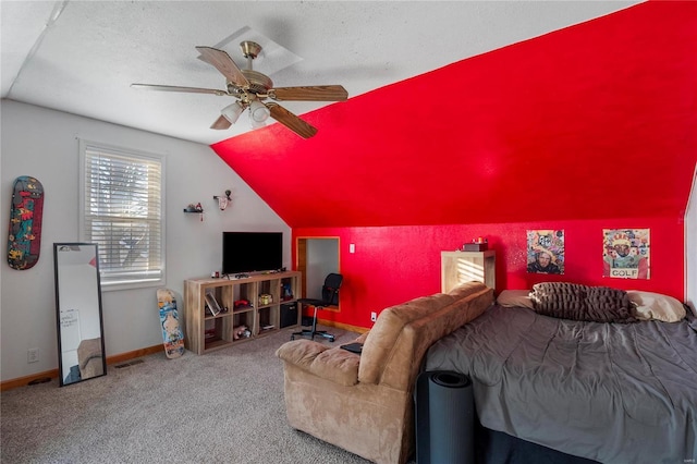 bedroom featuring carpet floors, vaulted ceiling, a textured ceiling, ceiling fan, and baseboards