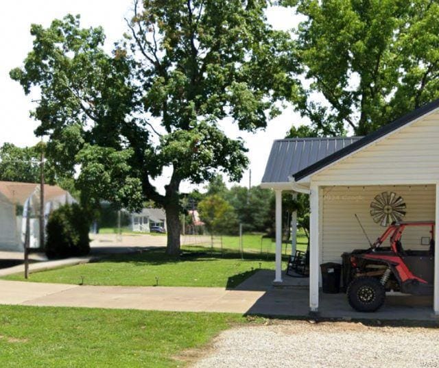 view of parking with a carport