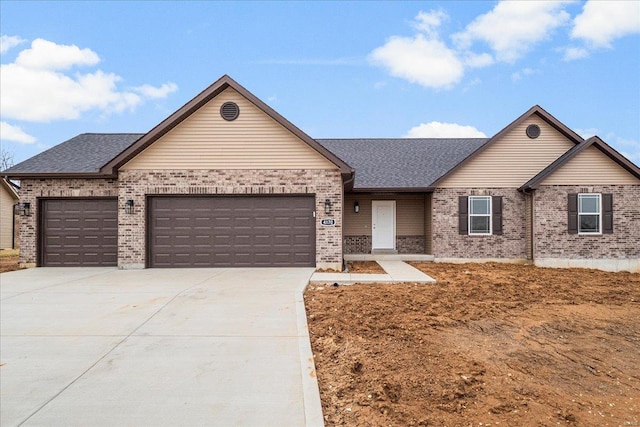 single story home with concrete driveway, brick siding, an attached garage, and a shingled roof